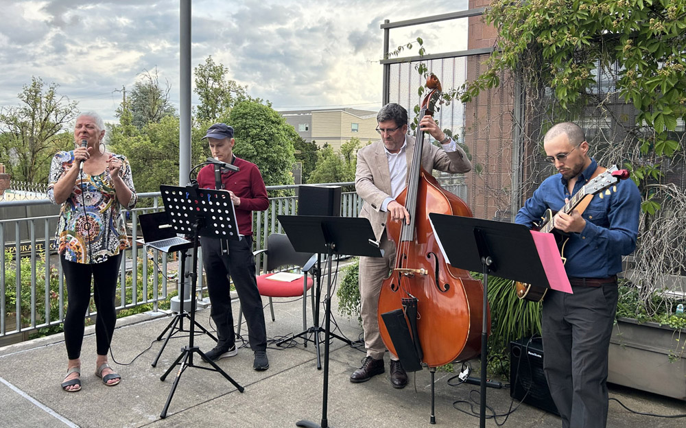 Lana and band performing on terrace